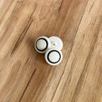 Bouton à tige rond effet tricot blanc/noir