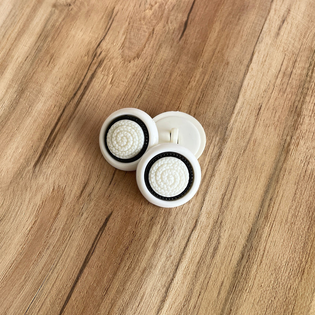 Bouton à tige rond effet tricot blanc/noir